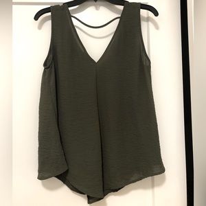 Hunter green diamond shaped tank top with an open back with strap across.